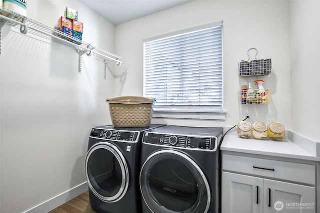 13426 108th St NE, Lake Stevens, WA 98258 - washroom featuring washer and clothes dryer, healthy amount of natural light, and dark wood finished floors