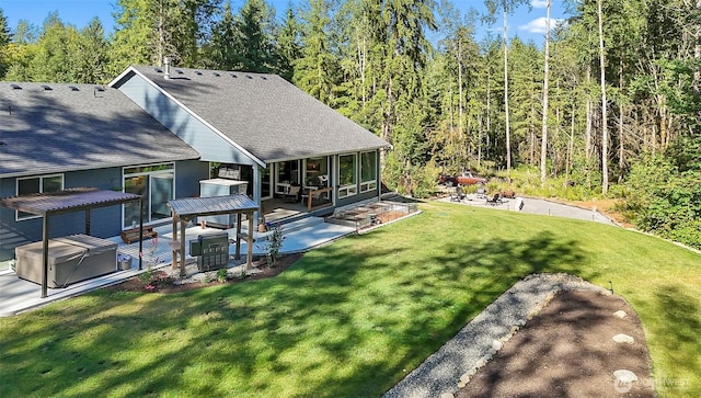 13426 108th St NE, Lake Stevens, WA 98258 - view of green lawn featuring a patio area, a sunroom, and a forest view