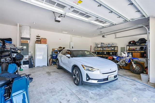 13426 108th St NE, Lake Stevens, WA 98258 - garage with freestanding refrigerator and a garage door opener