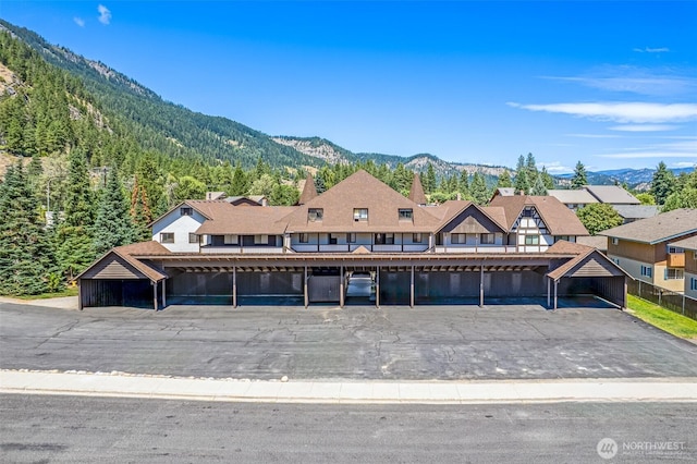 110 Icicle Unit K, Leavenworth, WA 98826 - view of front of property with a mountain view, a wooded view, and covered parking