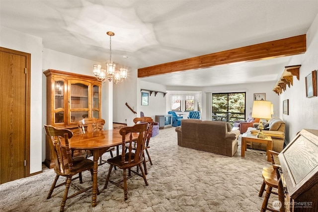 110 Icicle Unit K, Leavenworth, WA 98826 - dining space with light colored carpet, beam ceiling, and a chandelier