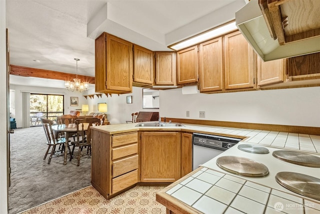 110 Icicle Unit K, Leavenworth, WA 98826 - kitchen featuring tile counters, dishwasher, exhaust hood, light carpet, and a peninsula