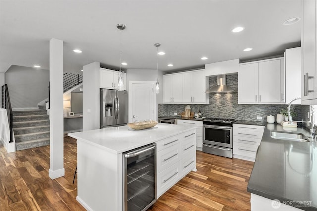 9909 123rd Ln NE, Kirkland, WA 98033 - kitchen with stainless steel appliances, beverage cooler, wall chimney range hood, dark wood-type flooring, and recessed lighting