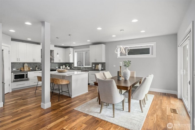 9909 123rd Ln NE, Kirkland, WA 98033 - dining space with wood finished floors and recessed lighting