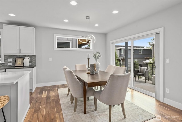 9909 123rd Ln NE, Kirkland, WA 98033 - dining room with light wood finished floors, recessed lighting, and a chandelier