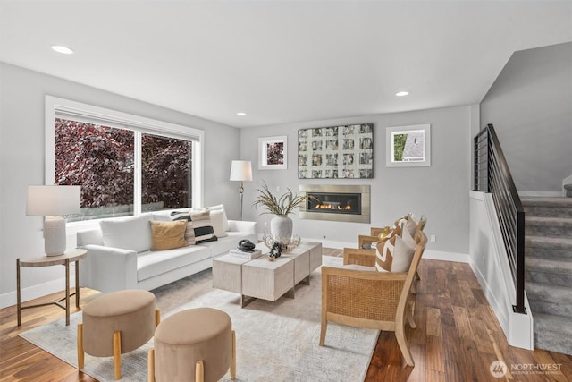 9909 123rd Ln NE, Kirkland, WA 98033 - living area featuring stairs, a glass covered fireplace, wood finished floors, and recessed lighting
