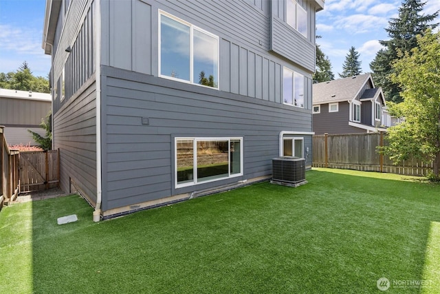 9909 123rd Ln NE, Kirkland, WA 98033 - rear view of property with board and batten siding and a fenced backyard