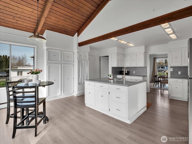 5041 Guide Meridian, Bellingham, WA 98226 - kitchen featuring white cabinets, wooden ceiling, light wood-style floors, and a center island with sink