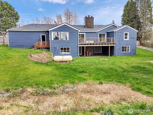 5041 Guide Meridian, Bellingham, WA 98226 - back of property with a wooden deck, a chimney, and a lawn