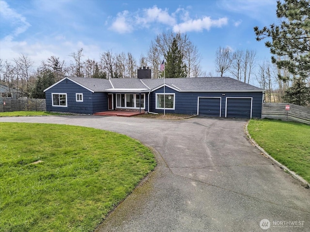 5041 Guide Meridian, Bellingham, WA 98226 - ranch-style house with asphalt driveway, a chimney, and an attached garage