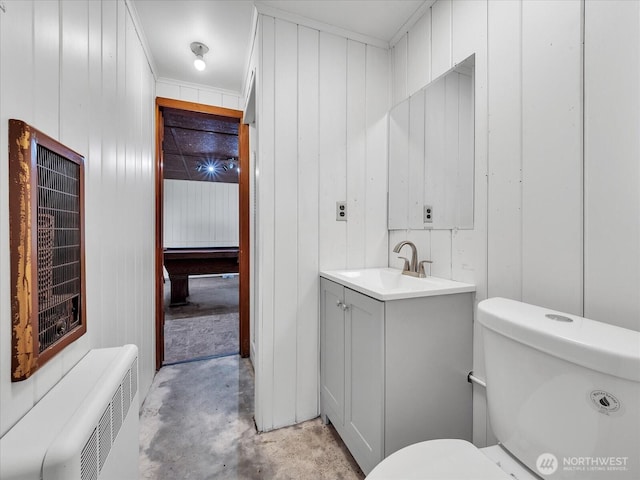 5041 Guide Meridian, Bellingham, WA 98226 - bathroom featuring vanity, concrete floors, wood walls, and radiator