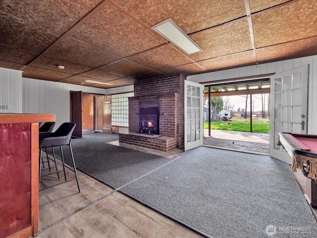 5041 Guide Meridian, Bellingham, WA 98226 - living area featuring a fireplace, plenty of natural light, and wood walls