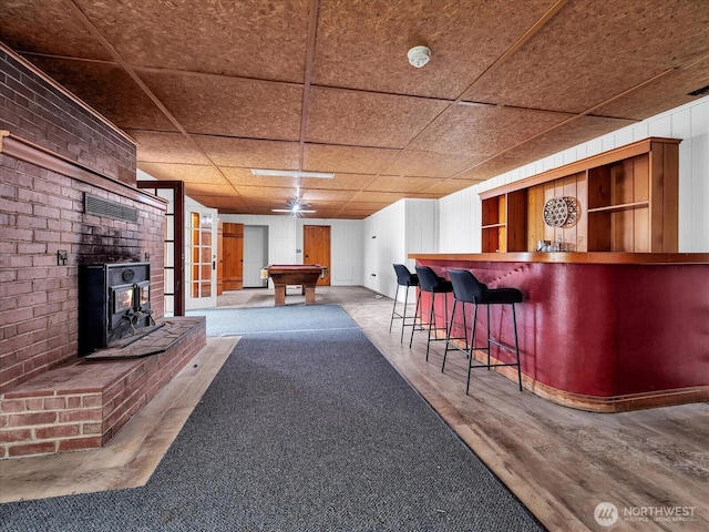 5041 Guide Meridian, Bellingham, WA 98226 - indoor dry bar featuring billiards, a ceiling fan, and a wood stove
