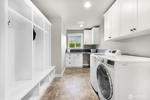 1312 Bradley Meadows Ct, Lynden, WA 98263 - washroom with washer and clothes dryer, cabinet space, stone finish flooring, and recessed lighting