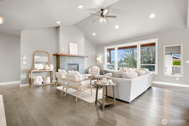 1312 Bradley Meadows Ct, Lynden, WA 98263 - living room with ceiling fan, a fireplace, healthy amount of natural light, wood finished floors, and high vaulted ceiling