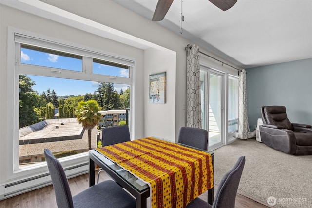 15152 65th Ave S Unit 818, Tukwila, WA 98188 - dining area featuring plenty of natural light, a ceiling fan, and wood finished floors