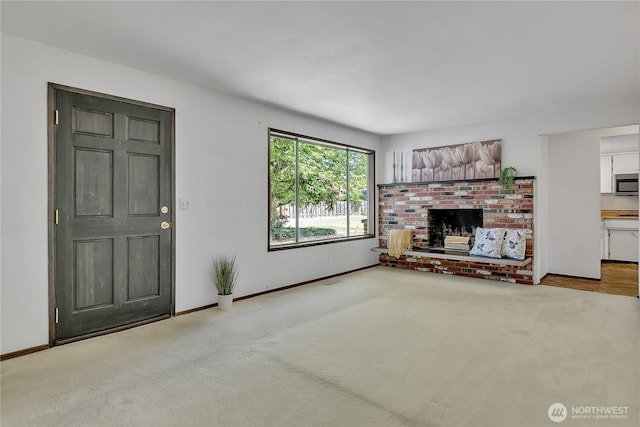 4239 S 184th Pl, Seatac, WA 98188 - unfurnished living room with a brick fireplace and carpet flooring