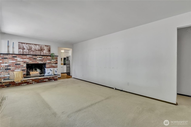 4239 S 184th Pl, Seatac, WA 98188 - unfurnished living room with light colored carpet and a brick fireplace
