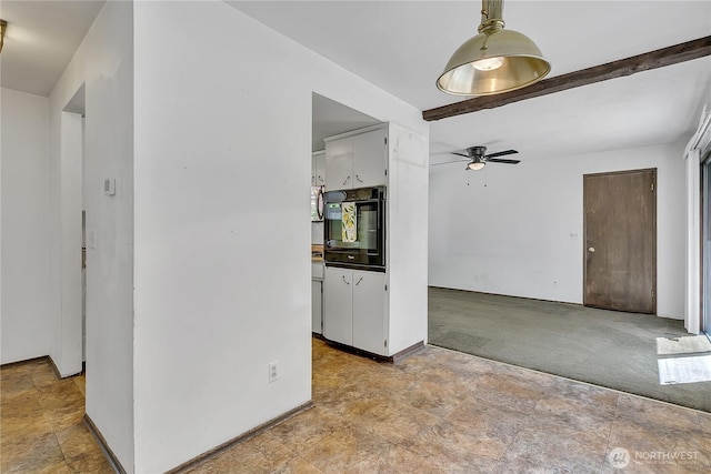 4239 S 184th Pl, Seatac, WA 98188 - carpeted spare room with a ceiling fan, stone finish floors, and beamed ceiling