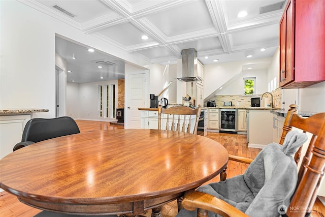 3915 Gilmore Rd, Everson, WA 98247 - dining room featuring light wood-style flooring, coffered ceiling, beam ceiling, recessed lighting, and beverage cooler