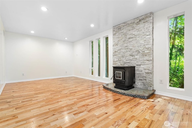 3915 Gilmore Rd, Everson, WA 98247 - unfurnished living room with hardwood / wood-style flooring, recessed lighting, and a wood stove