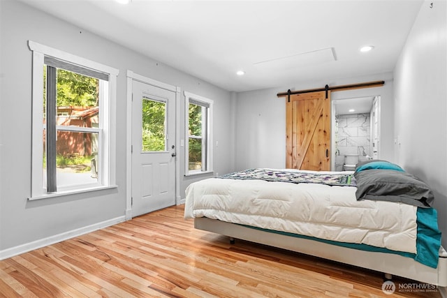 3915 Gilmore Rd, Everson, WA 98247 - bedroom featuring a barn door, wood finished floors, and recessed lighting