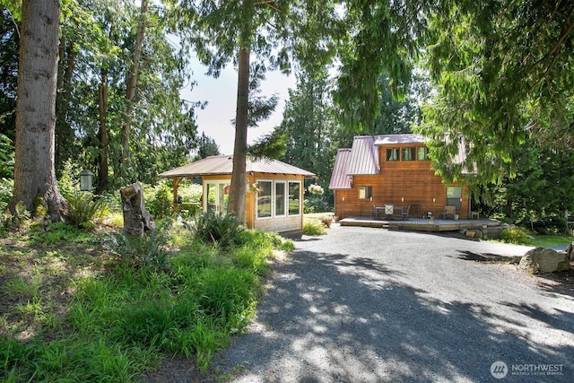 3915 Gilmore Rd, Everson, WA 98247 - chalet / cabin featuring driveway, a metal roof, and a deck