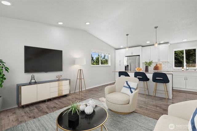 1713 S 30th St, Mount Vernon, WA 98274 - living area with lofted ceiling, plenty of natural light, wood finished floors, and recessed lighting