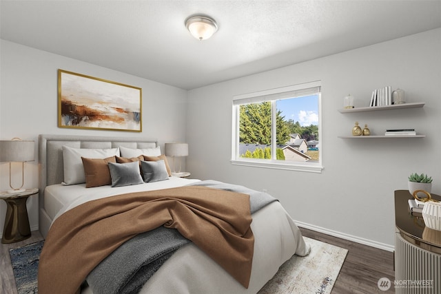 1713 S 30th St, Mount Vernon, WA 98274 - bedroom with dark wood-style floors and baseboards