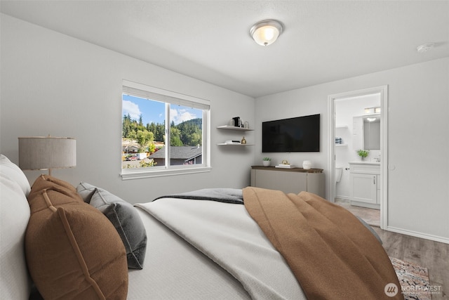 1713 S 30th St, Mount Vernon, WA 98274 - bedroom with wood finished floors and connected bathroom