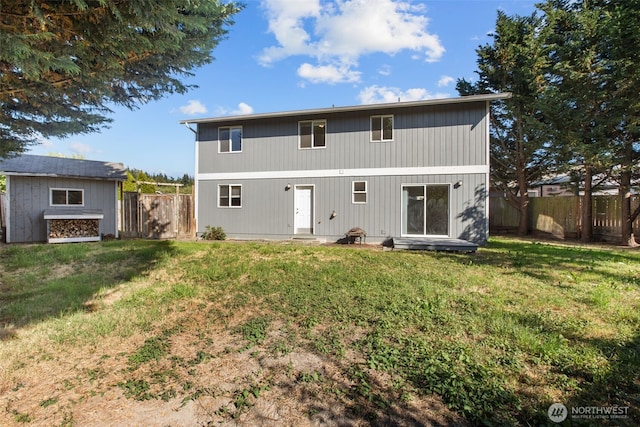 1713 S 30th St, Mount Vernon, WA 98274 - back of house featuring a fenced backyard, entry steps, and a storage unit