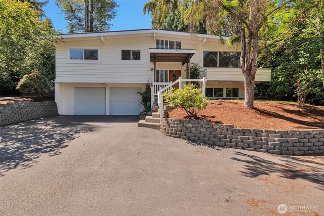 14627 SE Newport Way, Bellevue, WA 98006 - bi-level home with driveway and a garage