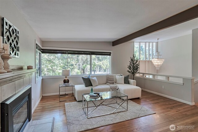 14627 SE Newport Way, Bellevue, WA 98006 - living area featuring a tile fireplace, wood finished floors, and a chandelier
