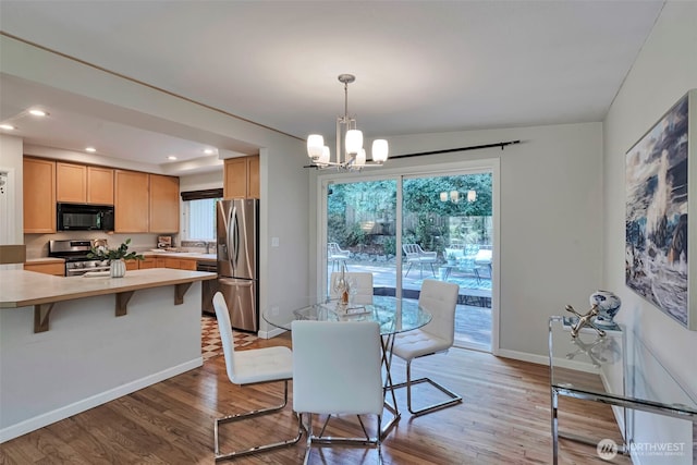 14627 SE Newport Way, Bellevue, WA 98006 - dining space featuring a chandelier, light wood-type flooring, and recessed lighting