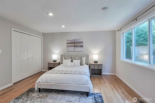 14627 SE Newport Way, Bellevue, WA 98006 - bedroom with light wood-style flooring, recessed lighting, and a closet