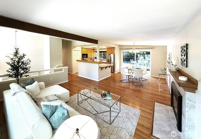 14627 SE Newport Way, Bellevue, WA 98006 - living area with light wood-style floors and a chandelier