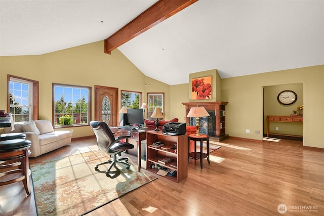 4054 Cabrant Rd, Everson, WA 98247 - home office with a glass covered fireplace, plenty of natural light, wood finished floors, beamed ceiling, and high vaulted ceiling