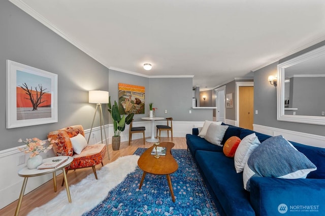 727 N 85th St Unit 102, Seattle, WA 98103 - living room with crown molding, wood finished floors, and a wainscoted wall
