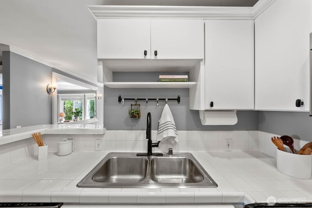 727 N 85th St Unit 102, Seattle, WA 98103 - kitchen featuring tile countertops, white cabinets, and open shelves