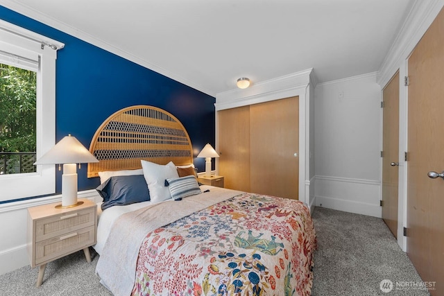 727 N 85th St Unit 102, Seattle, WA 98103 - bedroom with carpet, a closet, and crown molding