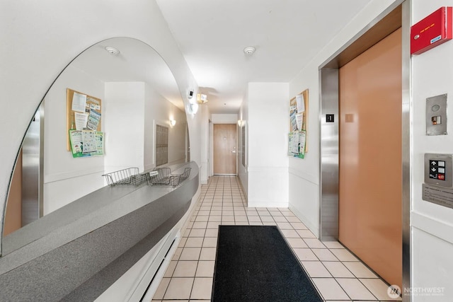 727 N 85th St Unit 102, Seattle, WA 98103 - hall featuring elevator and light tile patterned flooring