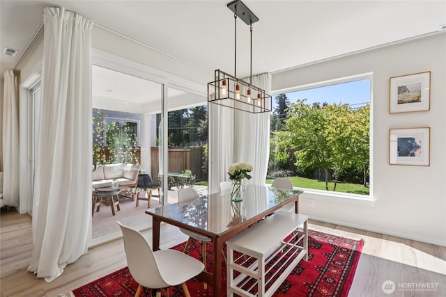 16204 27th Street Ct E, Lake Tapps, WA 98391 - dining room with a chandelier and light wood-style floors