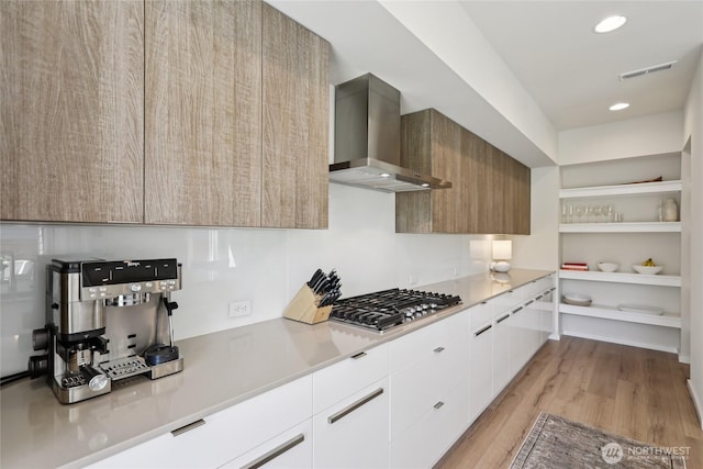 16204 27th Street Ct E, Lake Tapps, WA 98391 - kitchen featuring wall chimney exhaust hood, stainless steel gas cooktop, modern cabinets, light wood-style flooring, and recessed lighting