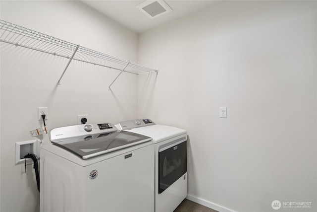 16204 27th Street Ct E, Lake Tapps, WA 98391 - washroom featuring washing machine and clothes dryer and baseboards