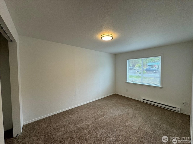16425 Broadway Ave, Snohomish, WA 98296 - spare room with a baseboard heating unit and carpet floors