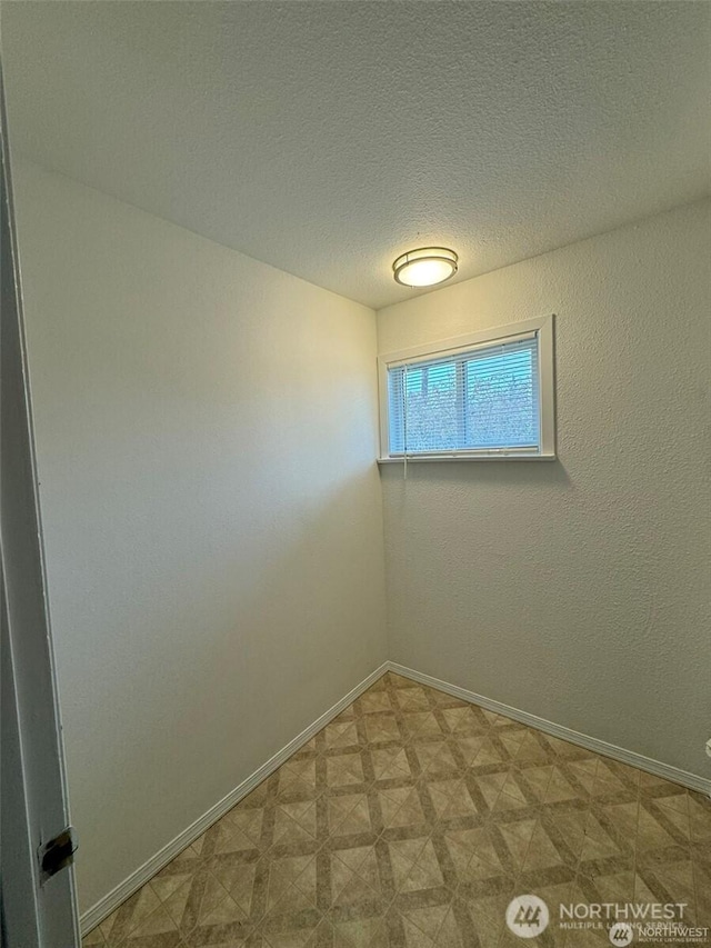 16425 Broadway Ave, Snohomish, WA 98296 - spare room with tile patterned floors and a textured ceiling