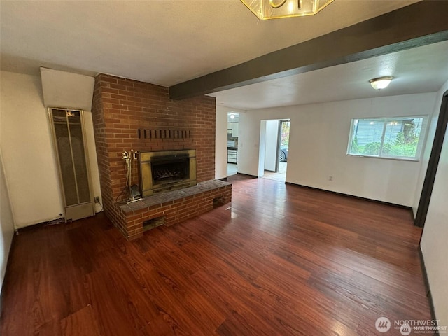 16425 Broadway Ave, Snohomish, WA 98296 - unfurnished living room featuring a fireplace, wood finished floors, and beam ceiling
