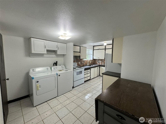 16425 Broadway Ave, Snohomish, WA 98296 - laundry area with washer and clothes dryer, light tile patterned floors, and a textured ceiling