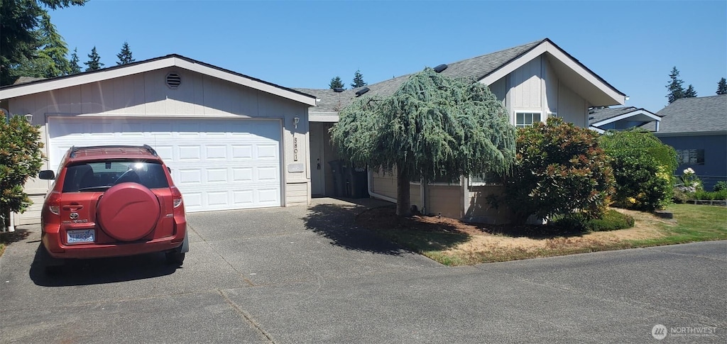 5801 89th Street Ct E Unit 5, Puyallup, WA 98371 - ranch-style home featuring driveway and roof with shingles