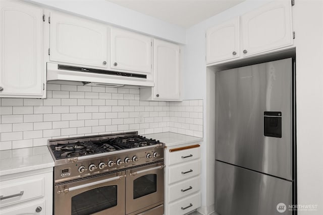 3527 Cain Rd SE, Olympia, WA 98501 - kitchen with stainless steel appliances, under cabinet range hood, light countertops, and white cabinets